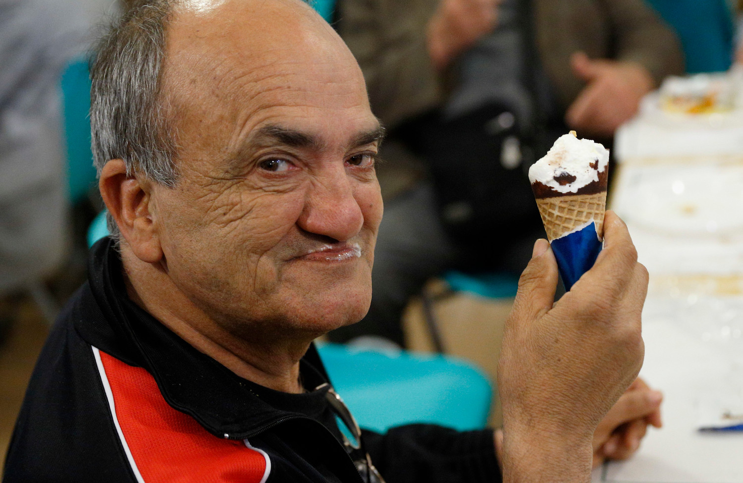 Antonino Siragusa enjoys an ice cream cone donated by Pope Francis at a Sant’Egidio soup kitchen in Rome April 23. In honor of his name day, the feast of St. George, the Pope donated 3,000 servings of ice cream to soup kitchens and homeless shelters around Rome.